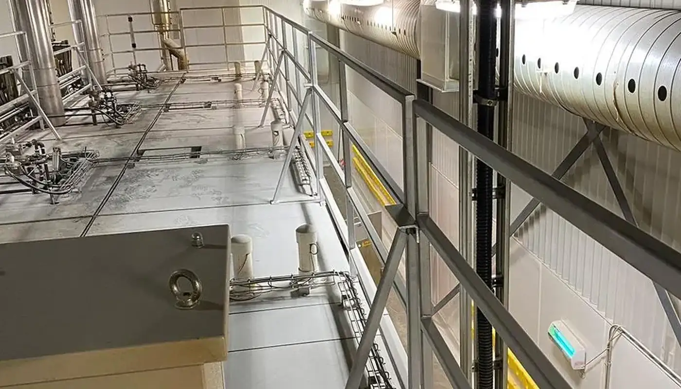Floating aluminum guardrail installed by Alliance on a plant mezzanine